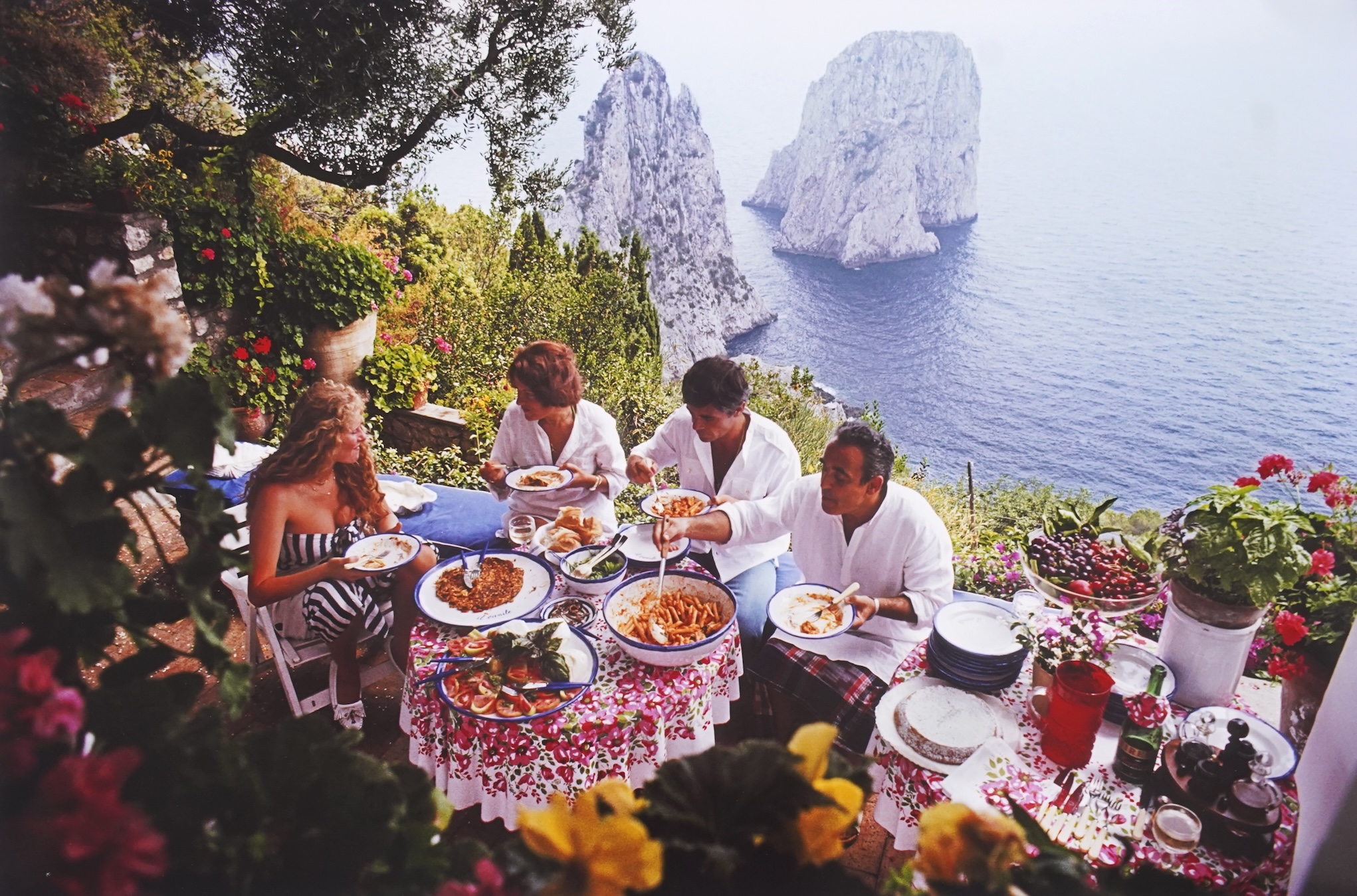 Slim Aarons, American 1916-2006, 'Dining al fresco on Capri, August 1980'